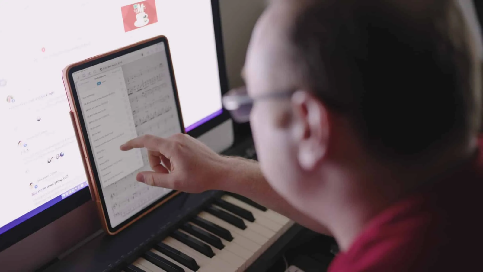 Brett Boles working on a song at his piano and studio setup